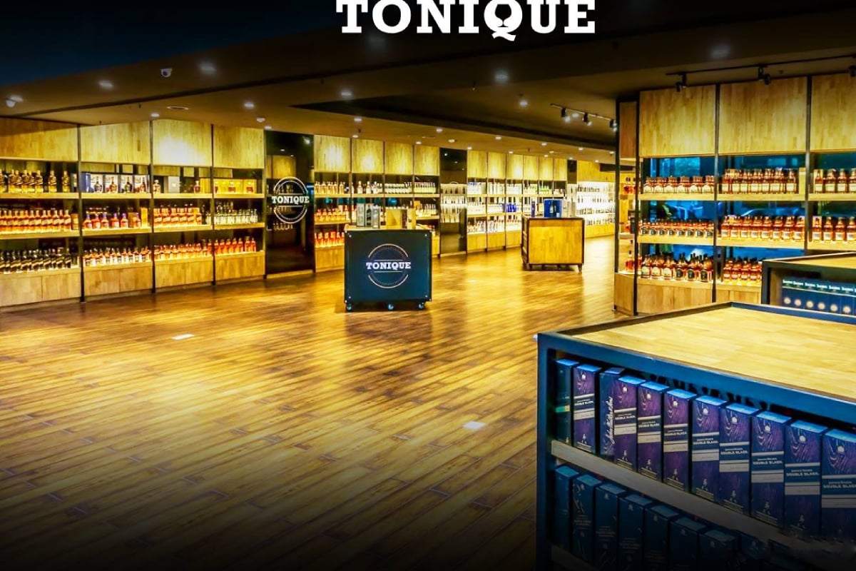 Organized illuminated spirit shelves at Tonique Bangalore